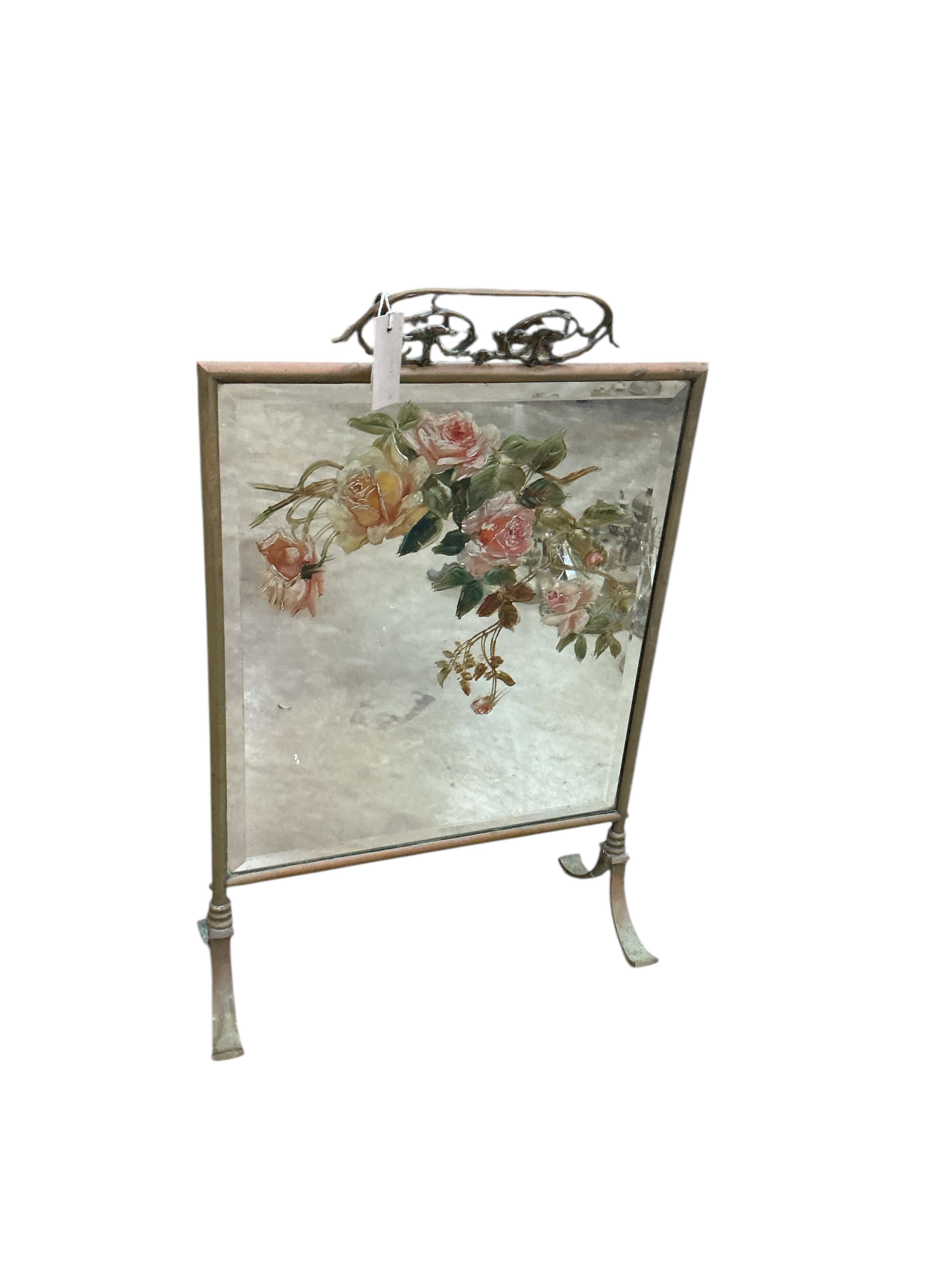 A late Victorian mirrored brass fire screen, height 70cm, together with a brass fender, ornamental brass and a leather bucket